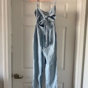 Express jean pantsuit with tie in the back.